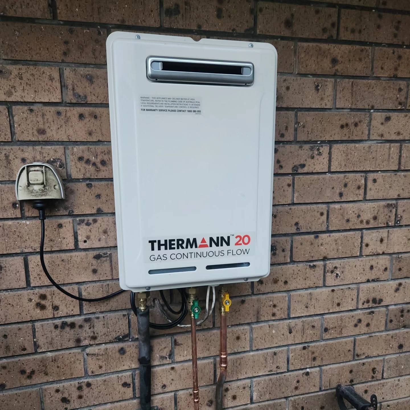 Completed Thermann gas continuous-flow hot-water unit with isolation valves and new copper connections